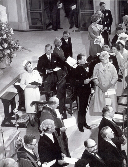 Photograph of the Queen and the Duke of Edinburgh awaiting the arrival of the Bishop
